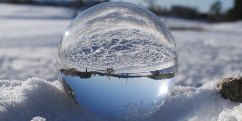 Lens ball view of a wintery landscape.