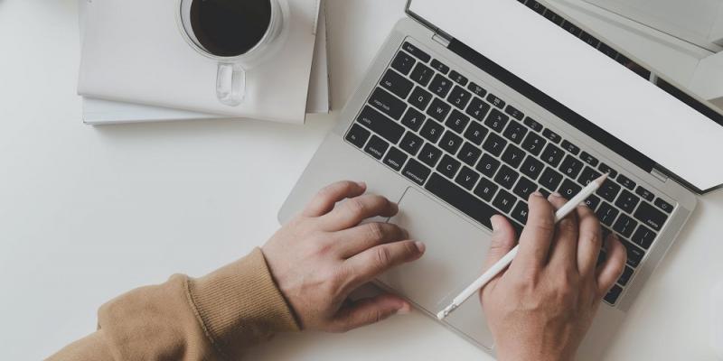 Hands on laptop keyboard