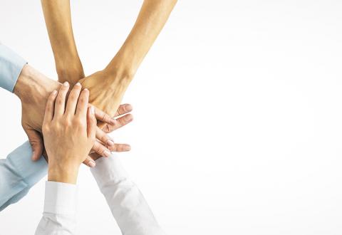 Illustrative picture of hands to signal collaboration